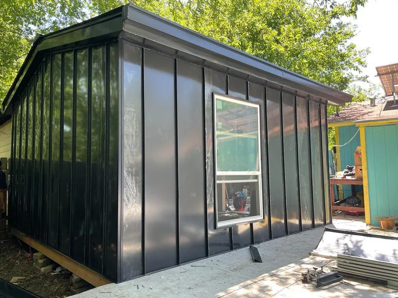 Black standing seam metal wall panels for Roof Inspection in West Deer